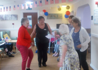 Residents and staff at Sonya Lodge dancing together