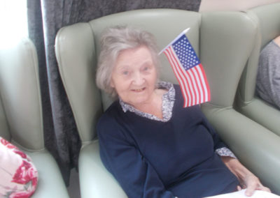Lady residents wearing an American flag in her hair