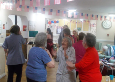 Staff and residents dancing