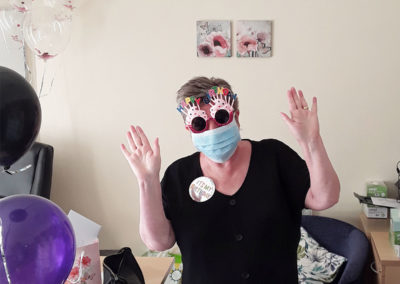 Manager Jean in a face mask and funny glasses at Sonya Lodge Residential Care