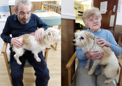 Residents at Sonya Lodge with a dog on their laps