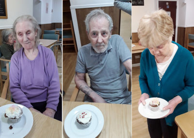 Sonya Lodge Residential Care Home residents showing their finished cake decorating designs
