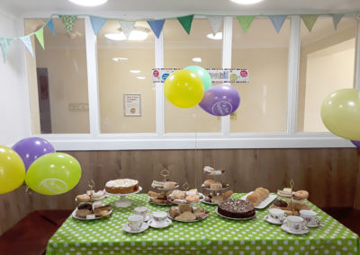 A table spread with cakes and bunting at Sonya Lodge Residential Care Home