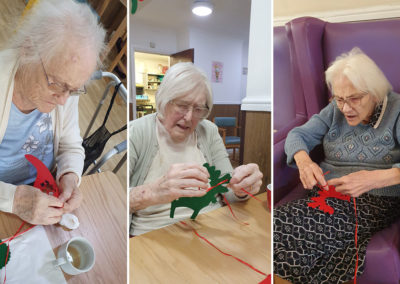 Sonya Lodge Residential Care Home residents threading festive decorations