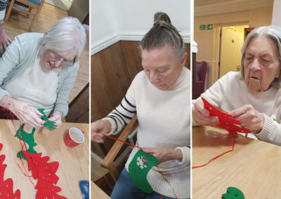 Sonya Lodge Residential Care Home residents threading Christmas decorations