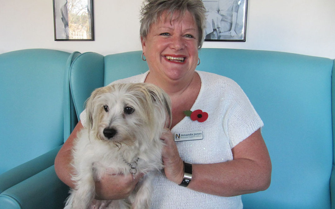 Sharing canine cuddles at Sonya Lodge Residential Care Home
