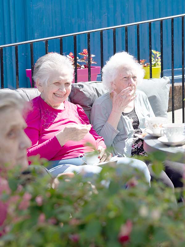 Lady Residents Sitting in Outdoor Area Representing Recreation and Leisure