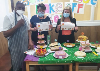 Sonya Lodge Residential Care Home Bake Off judging panel with certificates for winners
