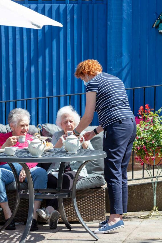 Afternoon tea in back garden at Sonya Lodge Residential Care Home