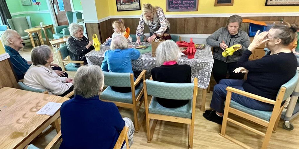 Sonya Lodge Residential Care Home residents enjoying arts and crafts with children