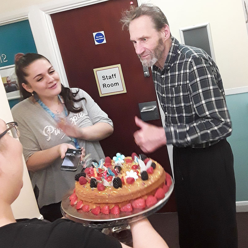Ray with his birthday cake at Sonya Lodge Residential Care Home