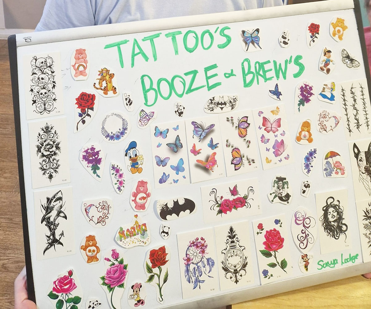 White board containing a range of colourful temporary tattoos